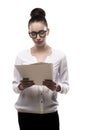 Office girl in glasses holds papers in hands isolated on white Royalty Free Stock Photo