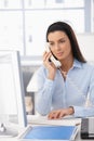 Office girl on landline call Royalty Free Stock Photo