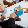 Office globe closeup, search for country to travel to.