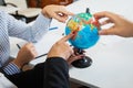 Office globe closeup, search for country to travel to.