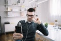 Office guy using phone and listening music in office Royalty Free Stock Photo