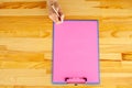 Office Hand Holding a Folder with a Pink Color Paper and Pen on the Background of the Wooden Table. Copyspace. Place for Text. Royalty Free Stock Photo