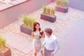 High angle view of businesswoman communicating with colleague at office terrace