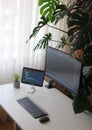 Office at home for developer with curved screen and tablet. Cozy workplace