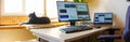 Home base office with IT equipment, laptop and online communications. Working from home and remote access concept. Panorama Royalty Free Stock Photo