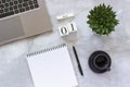 Office or home table desk. Wooden cubes calendar June 1st. Gray laptop, notepad, cup of coffee, succulent on marble background