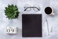 Office or home table desk. Wooden cubes calendar May 9. Black notepad, cup of coffee, succulent, glasses on marble background Royalty Free Stock Photo