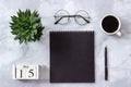 Office or home table desk. Wooden cubes calendar May 15. Black notepad, cup of coffee, succulent, glasses on marble background Royalty Free Stock Photo