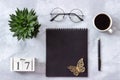 Office or home table desk. Wooden cubes calendar May 17. Black notepad, cup of coffee, succulent, glasses on marble background Royalty Free Stock Photo