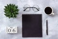 Office or home table desk. Wooden cubes calendar May 6th. Black notepad, cup of coffee, succulent, glasses on marble background Royalty Free Stock Photo