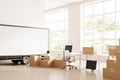 Office interior with cargo and armchair, moving boxes and panoramic window. Mockup Royalty Free Stock Photo