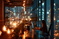 Office interior with panoramic windows overlooking the city at night. Business lady works in the office at night against
