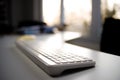 Office Keyboard with Sunset View Through Window Royalty Free Stock Photo