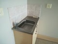 Office kitchenette with small basin