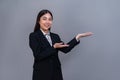 Office lady make hand holding gesture for advertisements. Jubilant