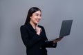 Office lady make hand holding gesture for advertisements with laptop. Jubilant