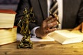 office of a lawyer with statue of Lady Justice, goddess Justitia, on the desk Royalty Free Stock Photo