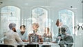 Office life. Group of business people discussing something while sitting at the office table behind the glass wall in Royalty Free Stock Photo