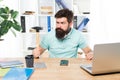 Office life makes him crazy. Businessman with beard and mustache gone mad with hammer in a hand. Angry aggressive Royalty Free Stock Photo