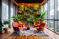 An office lounge has orange chairs and a green wall.