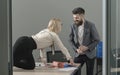 Office manager seduce boss on desktop. Office romance and sexual flirt concept Royalty Free Stock Photo