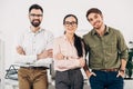 Office managers with arms crossed smiling and looking at camera