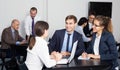 Office managers with laptops having a productive day Royalty Free Stock Photo