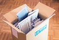 Office move - cardboard box with lots of computer keyboards Royalty Free Stock Photo