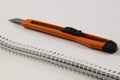 Office paper knife on notebook Royalty Free Stock Photo