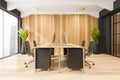 Office with 4 person desk, black details and wood wall