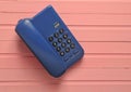 Office phone on a pink wooden table. on form Royalty Free Stock Photo
