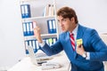 The office prank with kick me message on sticky note Royalty Free Stock Photo