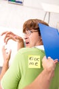 The office prank with kick me message on sticky note Royalty Free Stock Photo