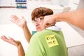 The office prank with kick me message on sticky note Royalty Free Stock Photo