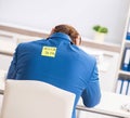 Office prank with kick me message on sticky note Royalty Free Stock Photo