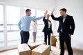 Office Relocation. Executives Making High Five Royalty Free Stock Photo