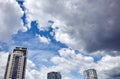 Office and residential skyscrapers on clear blue sky and clouds background Royalty Free Stock Photo