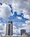 Office and residential skyscrapers on clear blue sky and clouds background Royalty Free Stock Photo