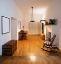 Office with rocking chair and parquet in the renovated apartment