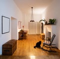 Office with rocking chair and parquet in the renovated apartment