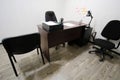 Office room with chair, table, lamp and stationery on it Royalty Free Stock Photo