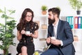 Office rumors. Office coffee. Couple coworkers relax coffee break. Share coffee with with colleague. Flirting colleagues Royalty Free Stock Photo