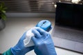 office sanitizing wipe wiping mouse and mousepad with disinfecting wipes. Coronavirus COVID-19 sanitize cleaning disinfection of Royalty Free Stock Photo