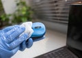 office sanitizing wipe wiping mouse and mousepad with disinfecting wipes. Coronavirus COVID-19 sanitize cleaning disinfection of Royalty Free Stock Photo