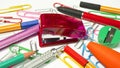 Office and school supplies, colorful objects placed on a white background. Royalty Free Stock Photo