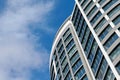 Office skyscraper high business building on blue sky background, looking up to glass modern building Royalty Free Stock Photo