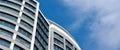 Office skyscraper high business building on blue sky background, looking up to glass modern building Royalty Free Stock Photo