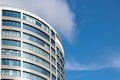 Office skyscraper high business building on blue sky background, looking up to glass modern building Royalty Free Stock Photo