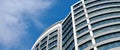 Office skyscraper high business building on blue sky background, looking up to glass modern building Royalty Free Stock Photo