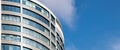 Office skyscraper high business building on blue sky background, looking up to glass modern building Royalty Free Stock Photo